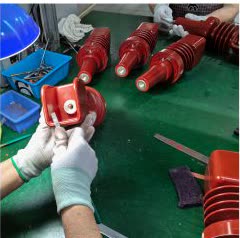 Mechanical deburring of an epoxy resin switchgear component
